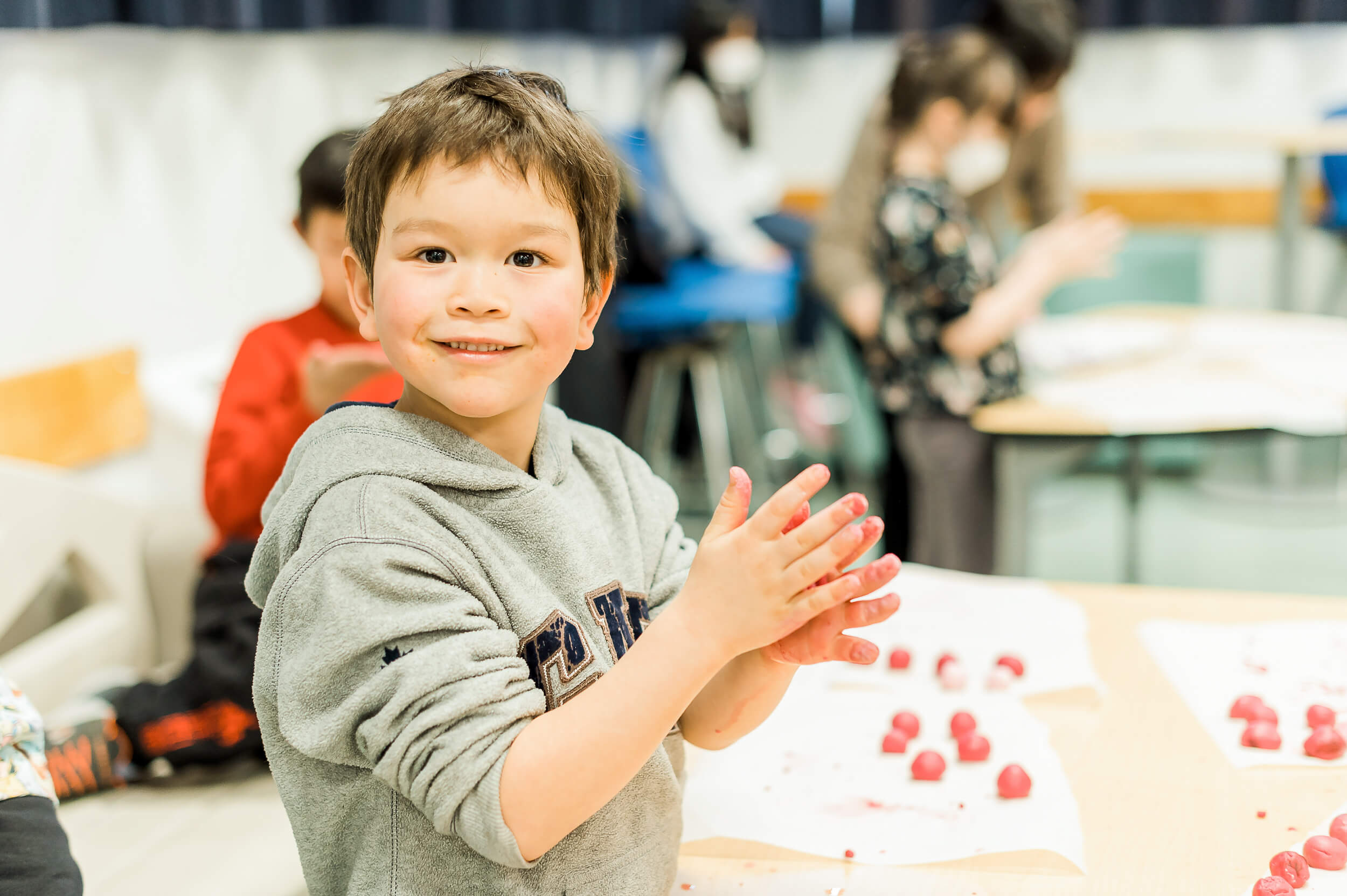 A Grade 1 student making rice dumplings at a public Edmonton Chinese School for lunar new year
