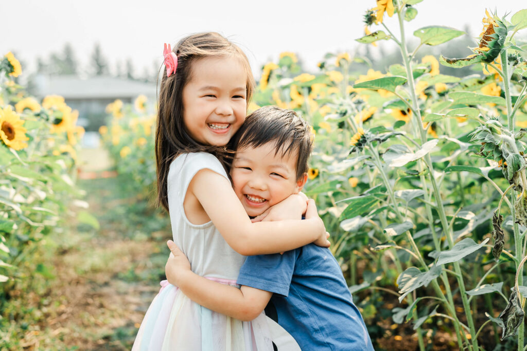 Edmonton Chinese kids playing in a sunflower field