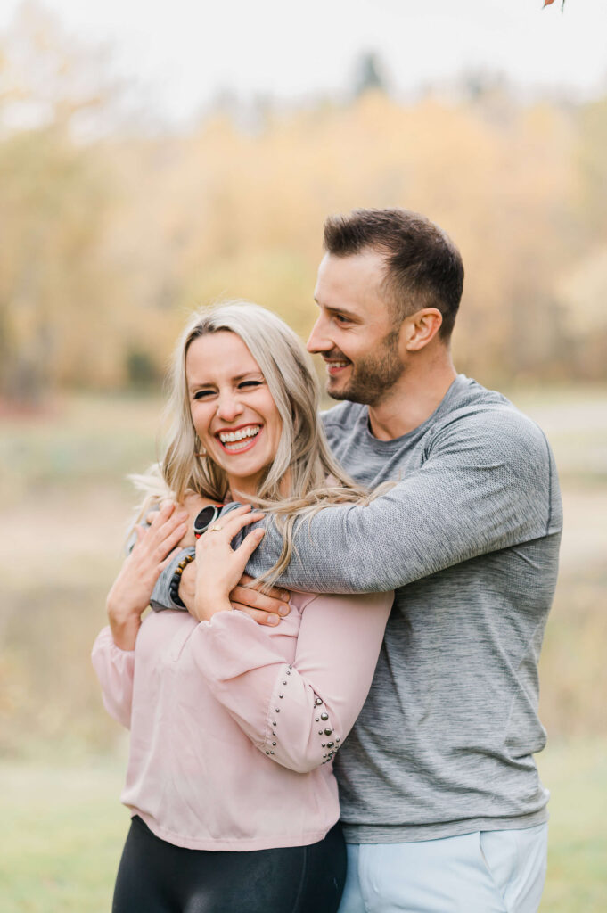 Candid moment of a couple laughing during a session with a Sherwood Park Photographer