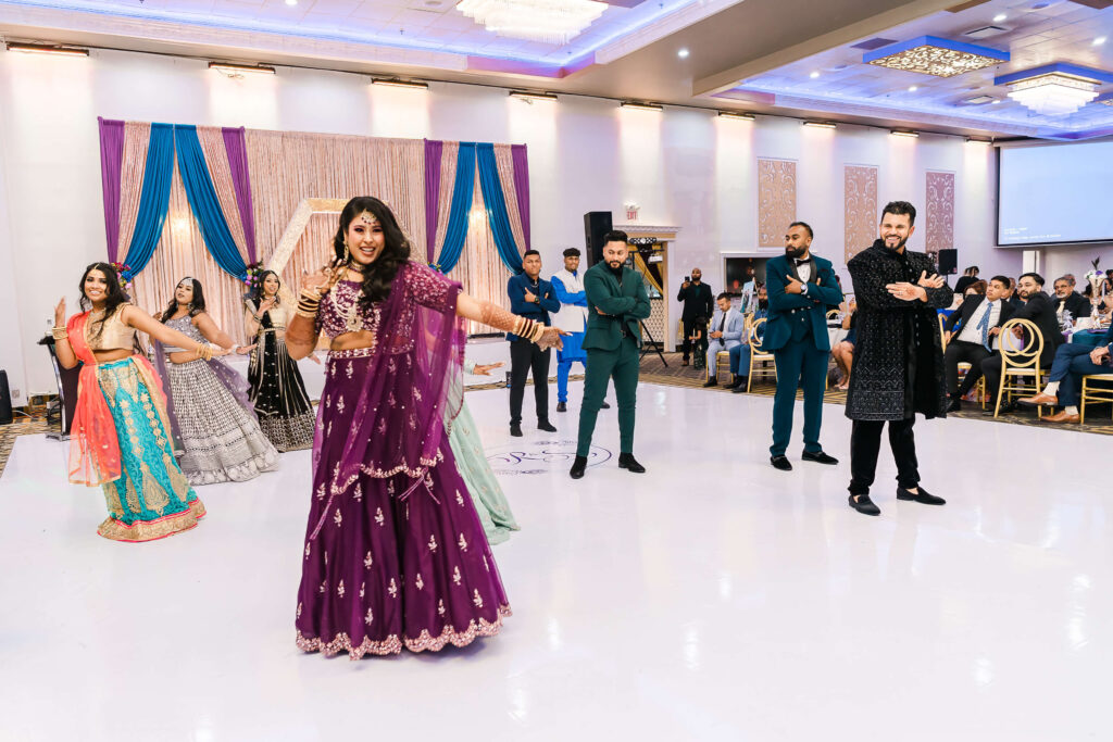 East Indian group cultural dance performance at a wedding reception in Edmonton, Alberta