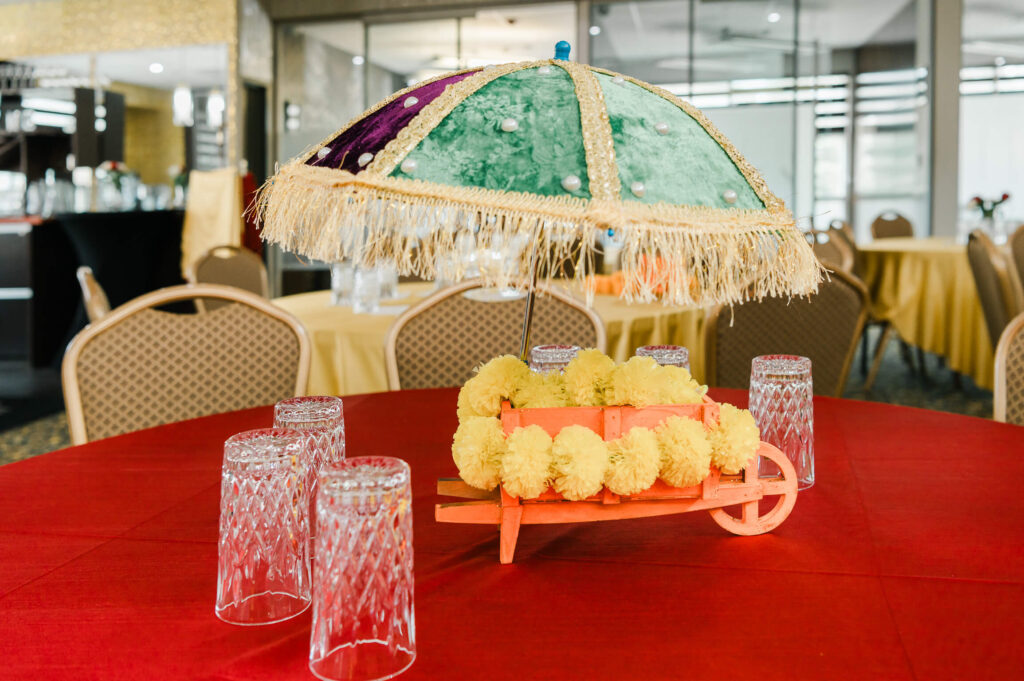 a table with a umbrella and glasses