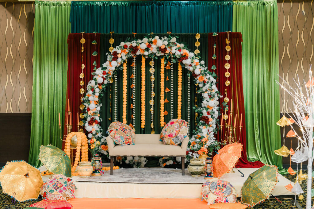 a stage with colorful curtains and a couch