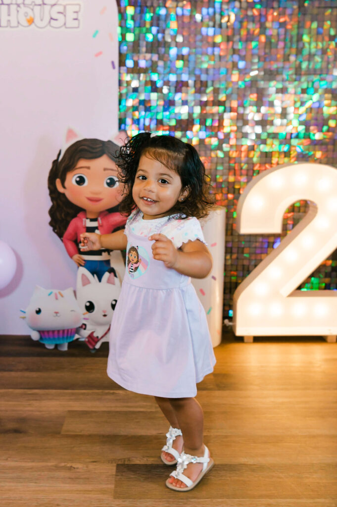 An Edmonton toddler playing around a decorated portion of an Edmonton indoor playground