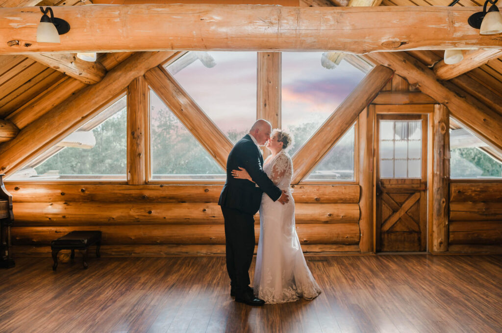 a man and woman in a wedding dress in a romantic embrace