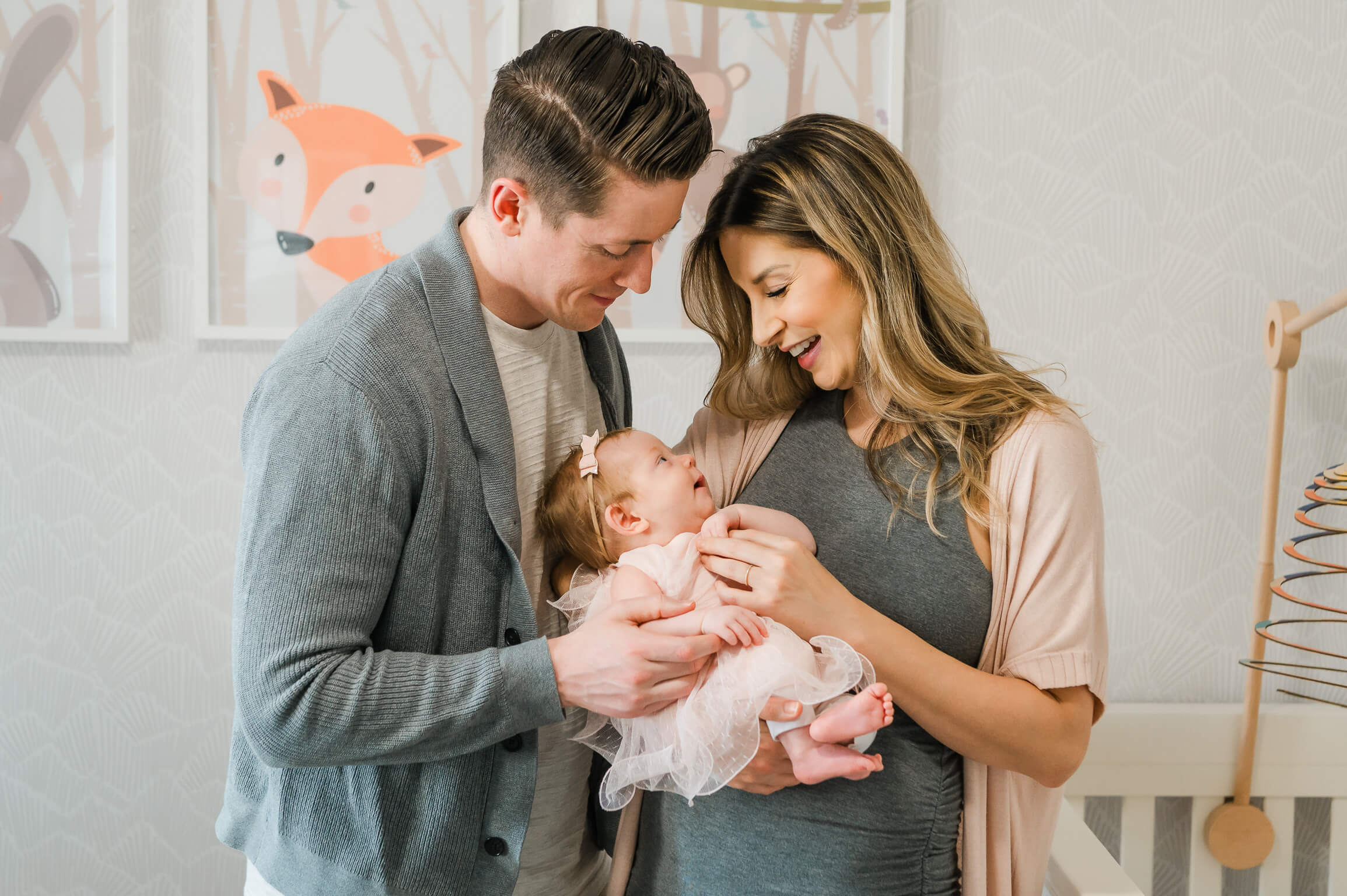 An Edmonton newborn girl looks lovingly at her mother before the family visits one of the Edmonton pediatricians