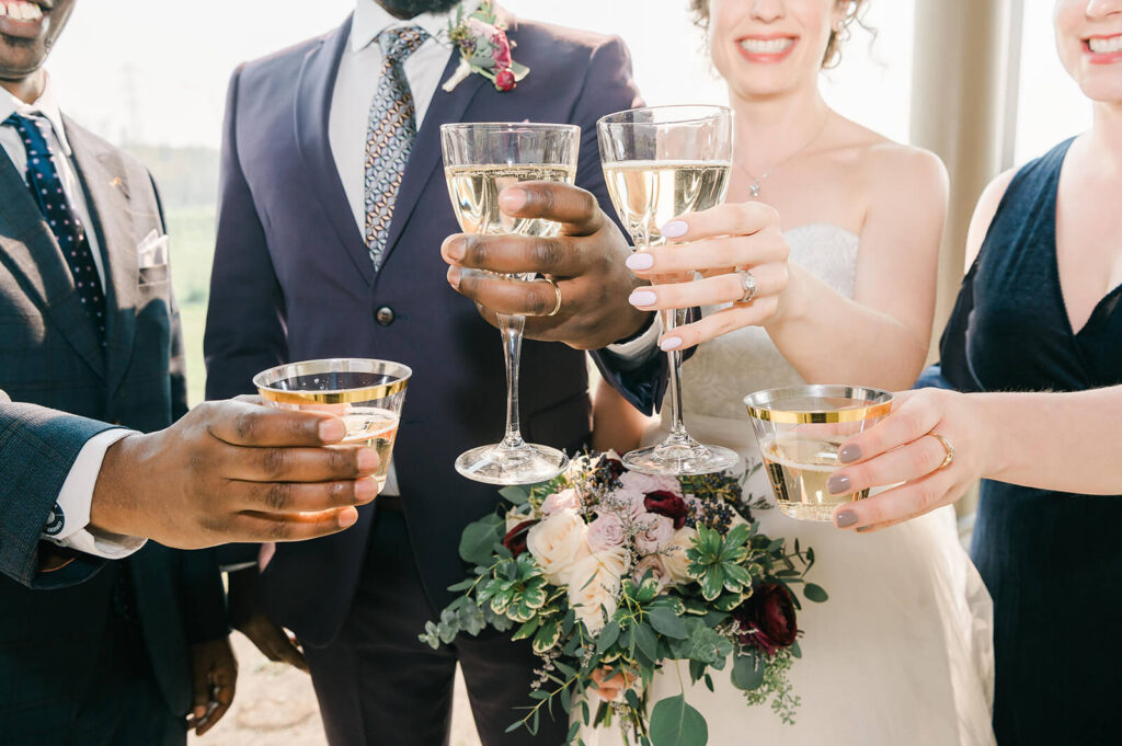 A toast post wedding ceremony of a biracial wedding couple in Edmonton celebrating with guests