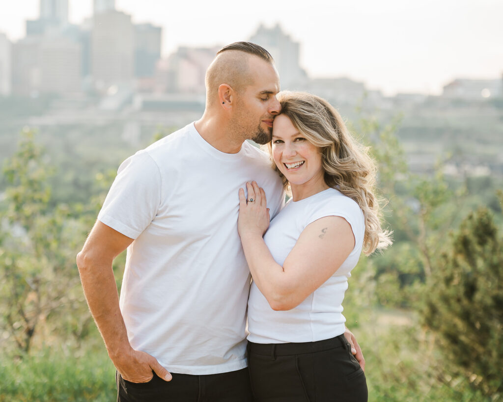 Strategic cuddles to showcase engagement ring during an engagement session with Cynthia Priest